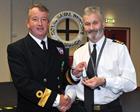 Cdre Miller presenting the South Atlantic Medal to Cdr Robin Wain
