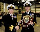Cdr Ross Spooner receiving the Australia Shield on behalf of 820 NAS