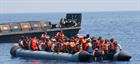 Migrants boat and Bulwark’s Landing Craft