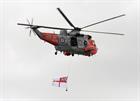 Sea King flying the White Ensign