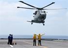 RN Merlin of 814 landing on deck of the Italian Aircraft Carrier ITS Cavour