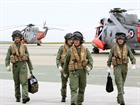 Lt Cdr Rich Full and his crew returning from a Flight