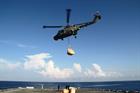 RFA Lyme Bay’s LYNX helicopter delivering aid