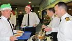 Captain Orchard and senior officers serving Christmas dinner 