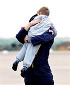 LAET Gav Babb hugs his son Jacob (5) after returning home to 815 Naval Air Squadron at RNAS Yeovilto