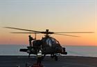 A United Arab Emirates Apache lands on the deck of RFA Fort Victoria