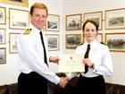 Lt Serena Davidson receiving her commendation from Vice Admiral Ben Key CBE