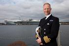 Captain Jerry Kyd with HMS Queen Elizabeth in the background.