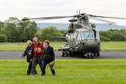Three landowners exiting a Royal Navy Merlin post flight