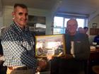 Capt Orchard presenting George Kosak with a montage of gliders