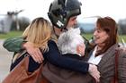 Pilot of 208 Flt, Lt Leonard is welcomed home by his family at RNAS Yeovilton
