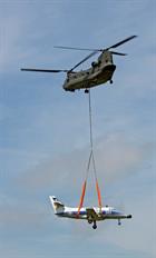 An RAF Chinook heavy lift helicopter from Odiham, moves the aircraft across the Lizard Peninsula