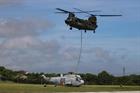 An RAF Chinook heavy lift helicopter from Odiham, moves the aircraft across the Lizard Peninsula