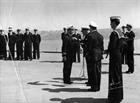 Lt(N) Sheppard being presented his DSC by Admiral Taylor aboard HMCS War...