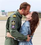 Flight Commander Lt Lee Holborn embracing his wife Alice