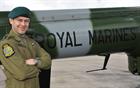 Lt Col Nic Ven RM next to the tail of Lynx ZD 282, the last flying Royal Marines Lynx 