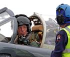Foxy Ladys pilot Commander Simon Hargeaves confers with a colleague during cockpit checks