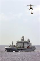 A Merlin ferries supplies from RFA Tidespring during the carrier deployment