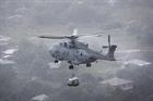 A Merlin flies aid into Honduras from RFA Argus after a hurricane