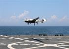 A US Navy drone delivers spare parts to at sea