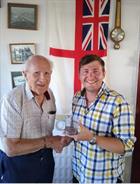 LAET McInerney is handed the ‘most progress’ award by Lt Bob Neill RNVR