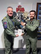 Lt Cook receives his QHI qualification from Lt Cdr Ian Oakes of the Central Flying School