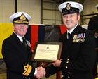Admiral Cunningham CBE presents CPO Copeland with a Certificate of Commendation