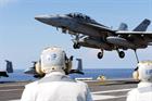 An F18 prepares to touch down on the Truman's flight deck after a sortie
