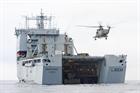 CHF Sea King prepares to deliver their cargo ashore from Royal Fleet Auxiliary (RFA) Mounts Bay