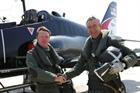 Lt Cdr Tim Taylor, (Left) being congratulated by  736 NAS Chief Pilot Nigel Wharmby