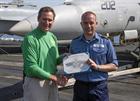 Stacy Gager receives his qualification from CO USS Enterprise