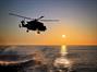 Wildcat - callsign Gauntlet - is silhouetted against the setting Med sun